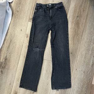 Wide leg black jeans with knee rip